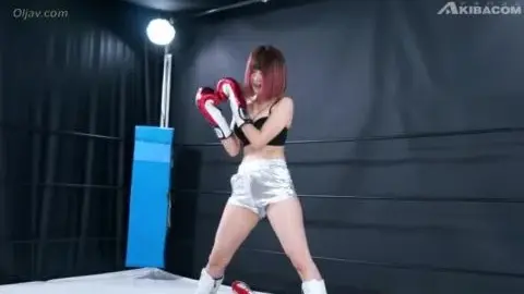 Redhead Punches in Boxing Gloves