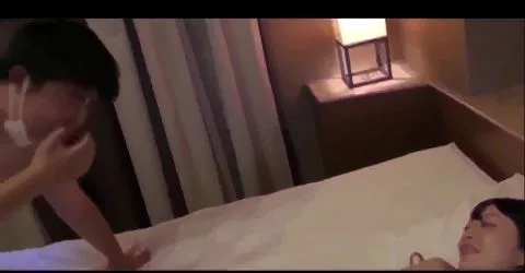 Asian Couple Intimate Moments in Hotel Room