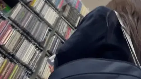 Asian Girl in Music Store
