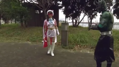 Asian Couple in Costumes Embracing in Park