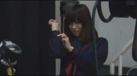 Asian Brunette in Red Costume and Mask