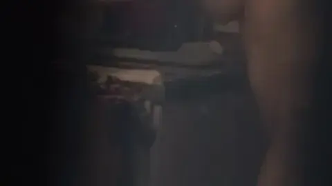 Blonde Masturbating in Dimly Lit Bathroom