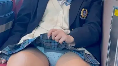 Asian Teen in School Uniform on Train