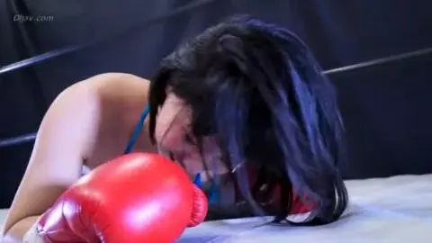 Asian Woman in Blue Bikini Boxing