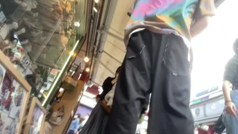 Asian Woman in Shopping District POV