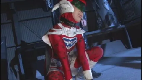 Asian green-haired girl restrained in industrial setting