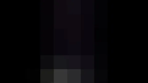 Woman in Plaid Skirt on Escalator