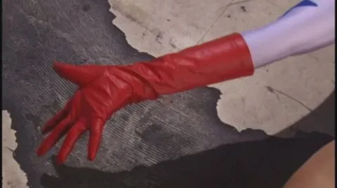 Asian Blonde in Fetish Outfit Performs Solo