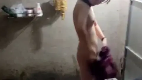 Asian Girl Getting Dressed in Bathroom