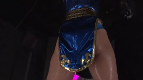 Asian Woman in Blue and Gold Costume with Men