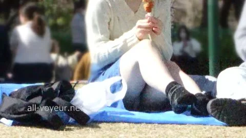 Asian Couple Enjoying Ice Cream in Park
