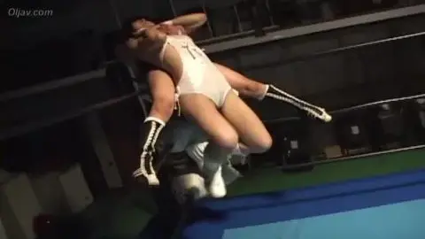 Asian Wrestlers Engage in Intense Match