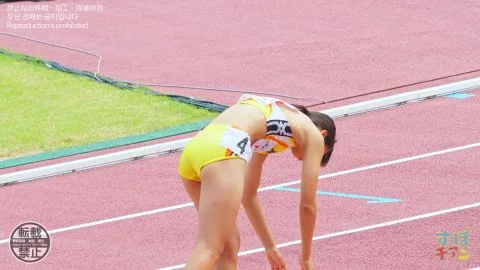 Asian Athletes in Sports Bras Running on Track