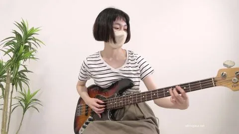 Asian Girl Playing Bass Guitar