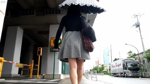 Asian Woman Sitting with Legs Apart