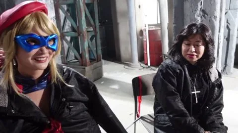 Asian Blonde in Red Beret and Blue Costume