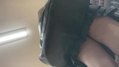 Slim Brunette in Black Skirt and Leather Jacket