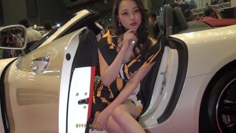 Asian Girl in Tiger Dress Sitting in Convertible Car