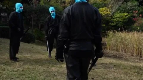 Asian Women in Costume Play with Swords