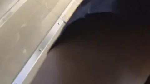 Asian Girl in Black Dress by Train Tracks