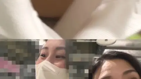 Women in Masks and Pink Clothing