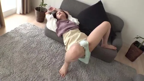 Asian woman undressed and touched in living room