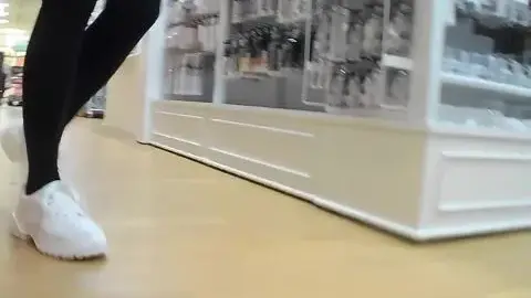 Asian Girl in Stockings and Sneakers in Store