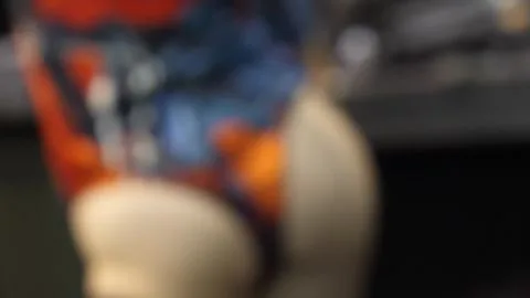 Asian Model Posing in Car Show Setting