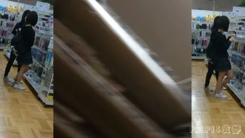 Asian Girl in Black Outfit Explores Bookstore