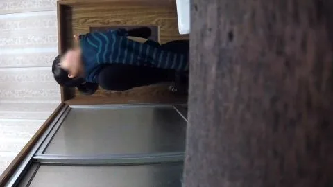 Asian Girl Washing Face in Bathroom