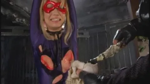 Blonde Women in Fetish Costumes Engage in Kinky Play