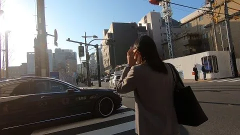 Asian Couple Walking on City Street