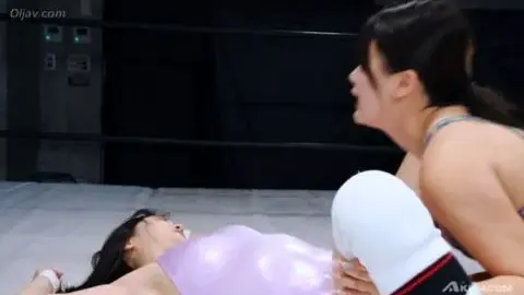 Asian Women Wrestling in Shiny Bodysuits
