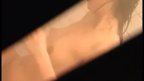 Asian Woman Showering and Touching Breasts