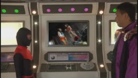 Asian Women in Costumes Engage in Wrestling Match