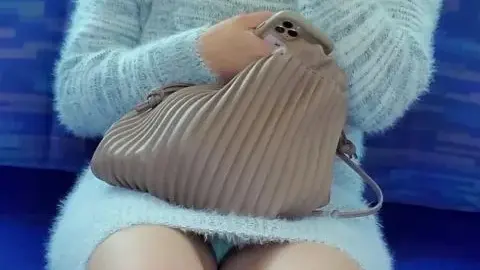 Asian woman with bruises on train