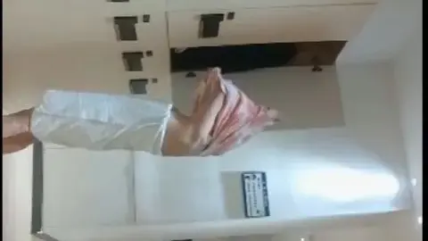 Asian Couple in Hotel Hallway