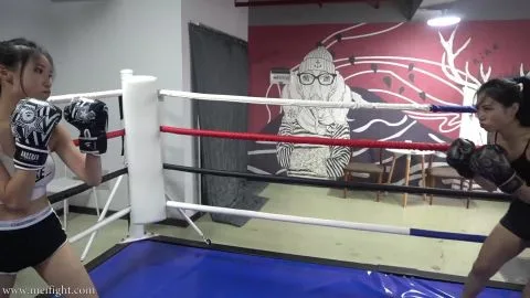 Asian Women Kickboxing in Gym