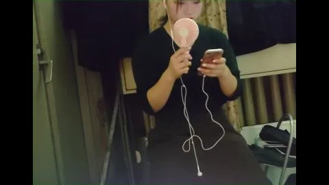 Asian Lesbian Intimacy in Dimly Lit Bedroom