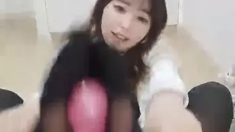 Asian Teen with Bunny Ears in Bedroom