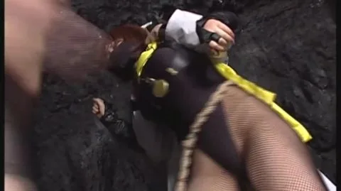 Tied Up Performers in Erotic Scene