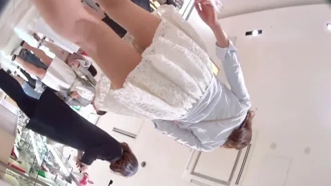 Girls Trying On Outfits in Clothing Store