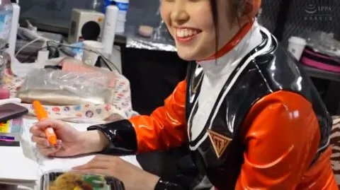 Asian Performer in Red Spandex Suit