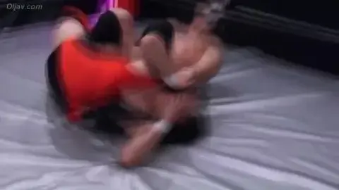 Asian Women Wrestling in Ring