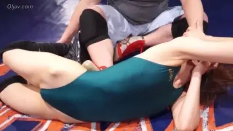 Asian Wrestlers in Teal and Blue Leotards Engage in Grappling