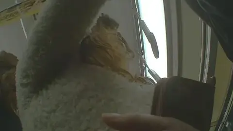 Blonde Women in Red Coat and White Sweater