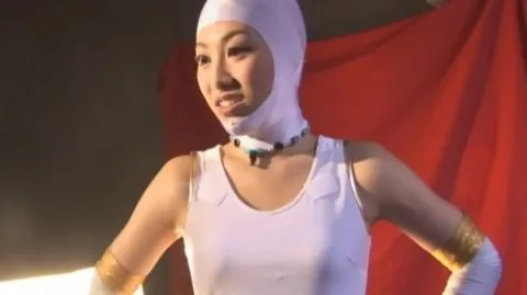 Asian Performer in White Costume and Mask