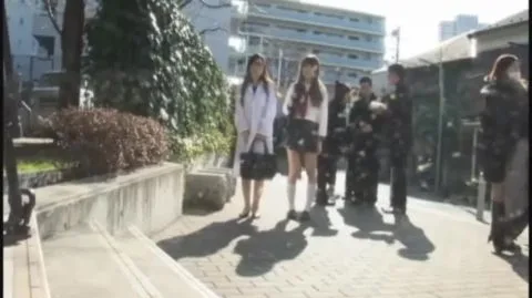 Asian Girls in Masks Engage in Intimate Encounter