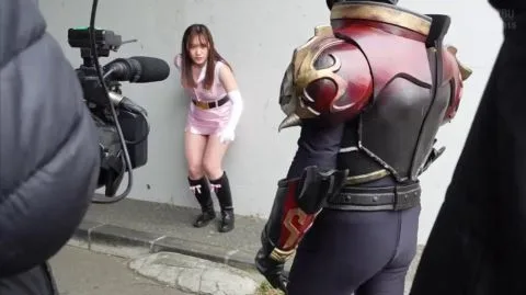 Asian Couple in Pink Costume Posing Outdoors