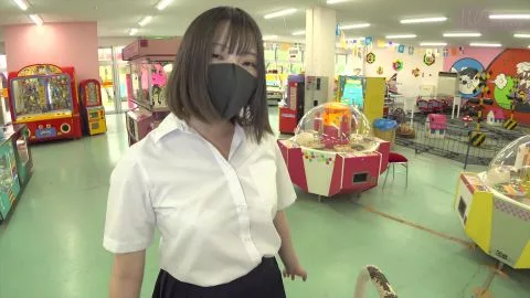 Asian teen playing claw machine